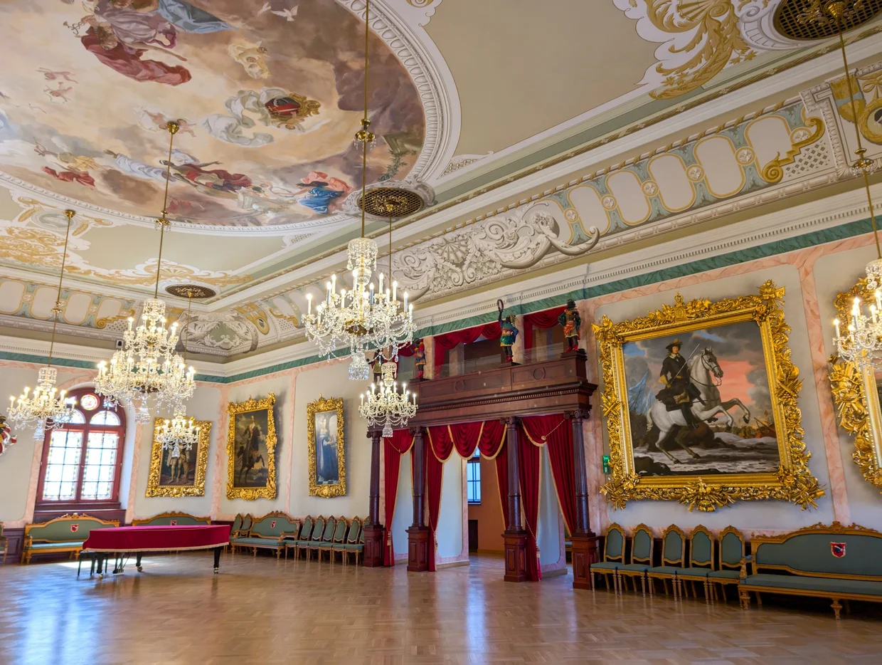 The ornate Great Hall inside the House of the Blackheads with frescoed ceiling