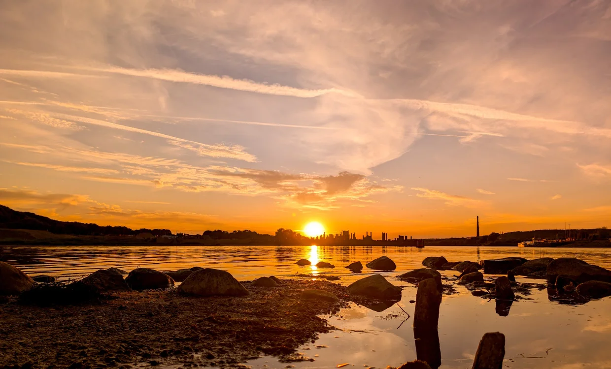 Sunset over the Nemunas river with the Kaunas silhouette in the distance