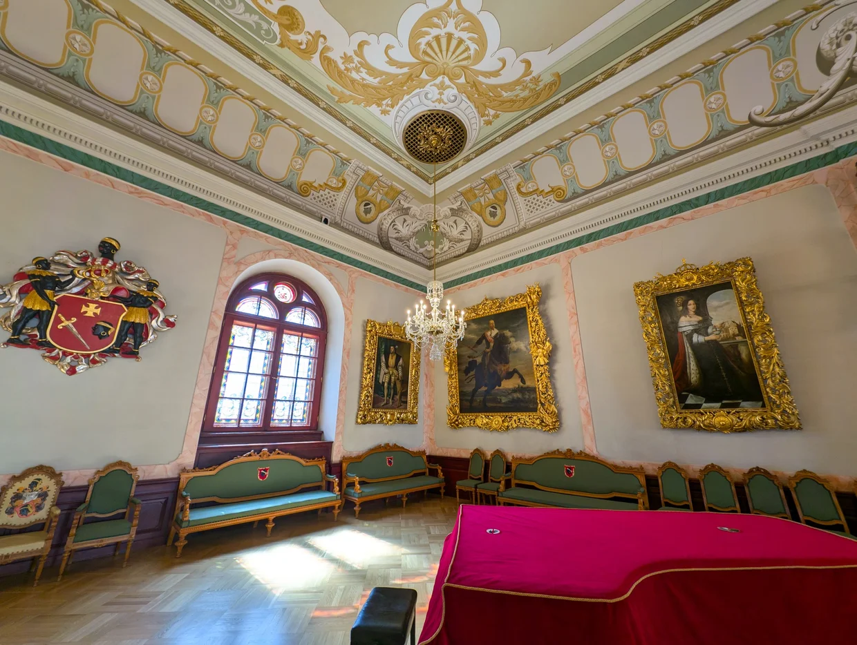 Another ornate room in the House of the Blackheads with paintings and period furniture