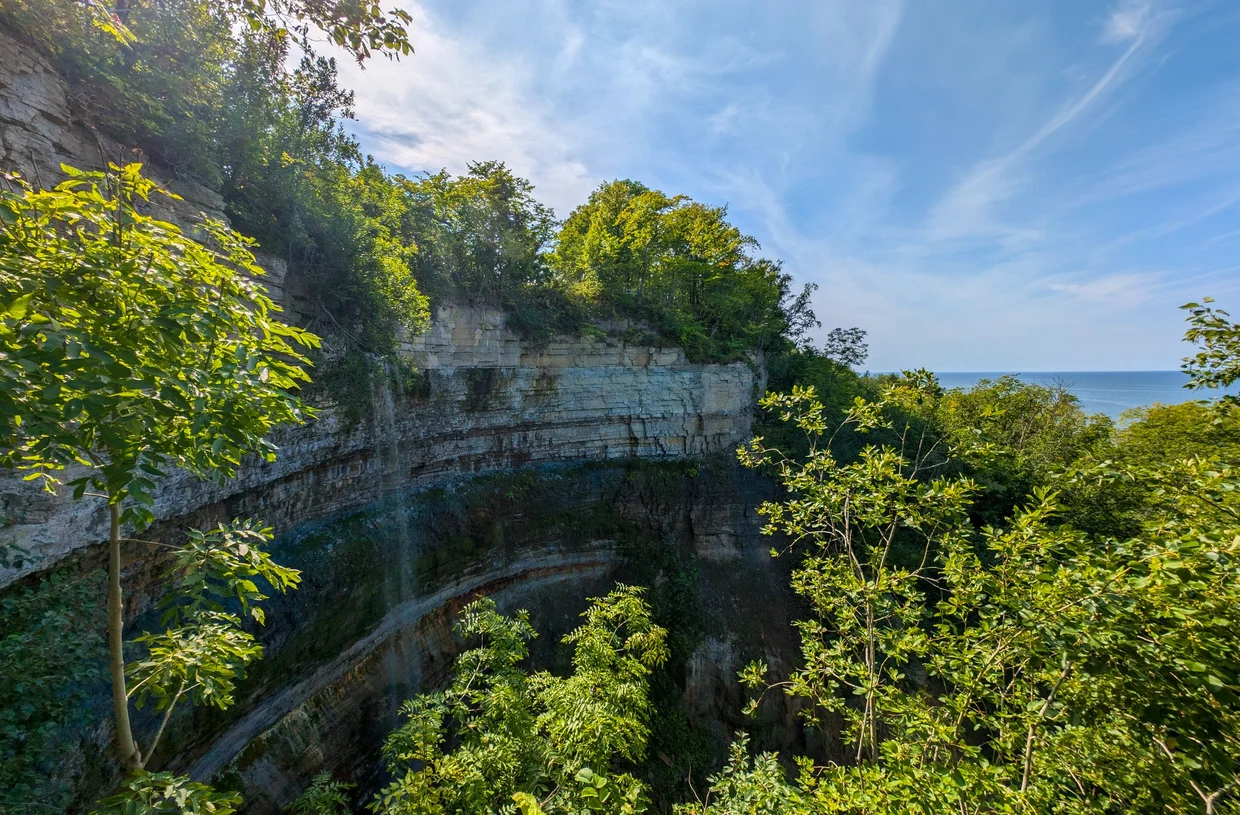 Valaste waterfall dropping over a pale limestone cliff in north Estonia