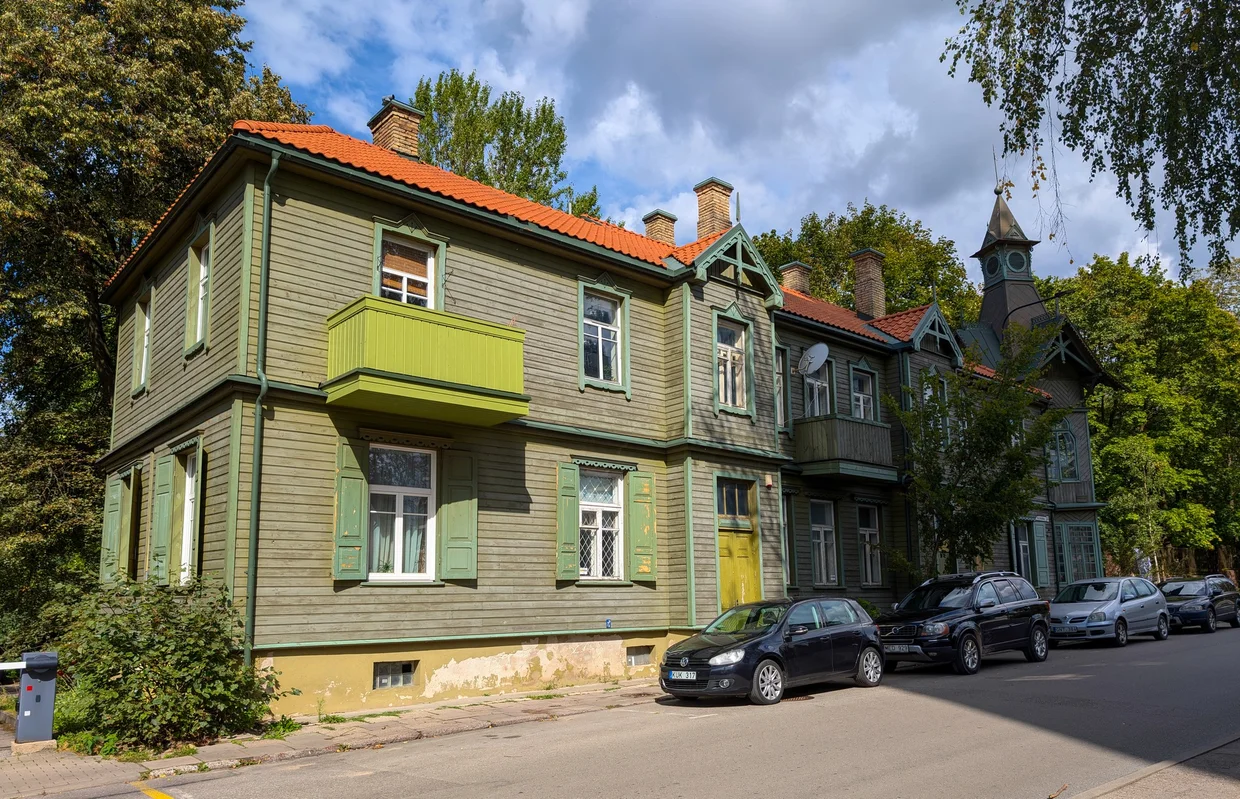 Wooden houses with orange roofs on a quiet Vilnius street
