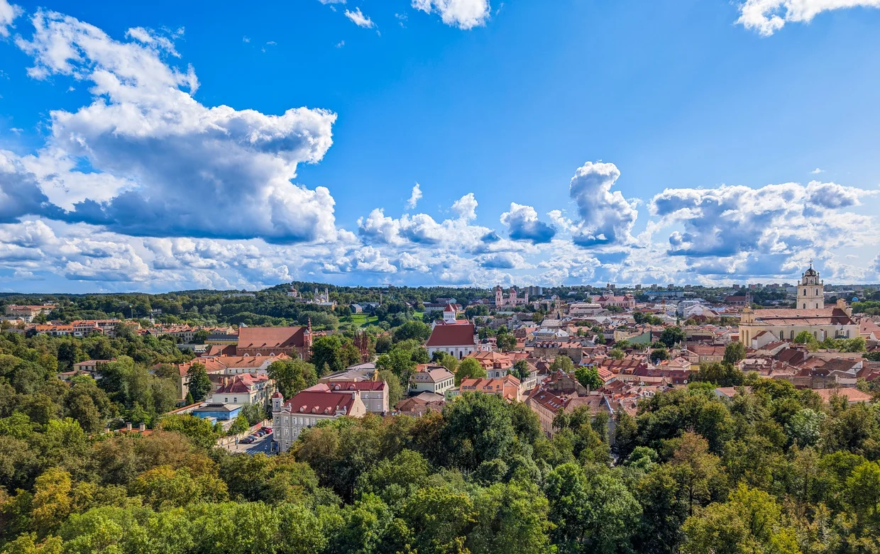 View of Vilnius Old Town from Gediminas Hill with cathedrals and red roofs