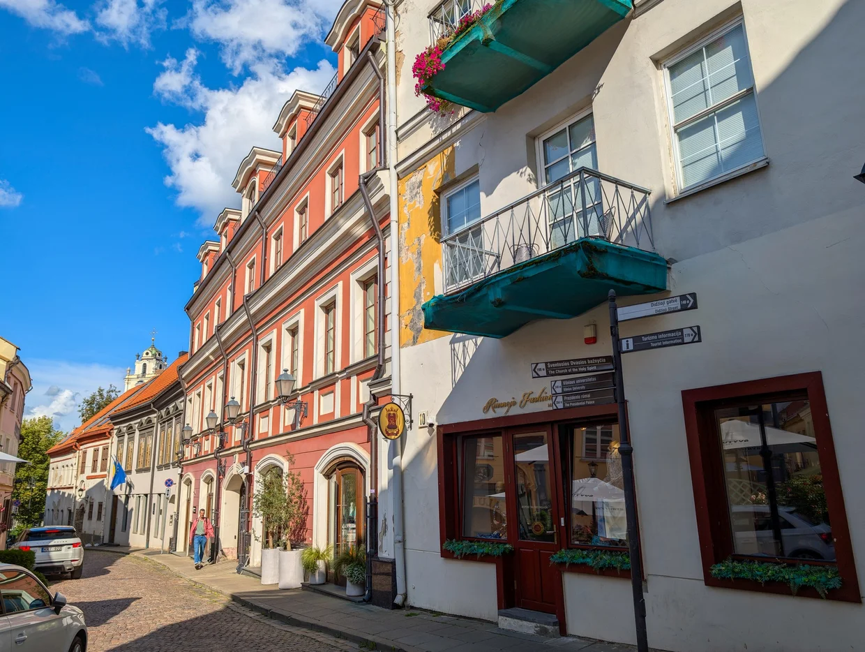 Pilies Street in Vilnius with colorful facades and balconies