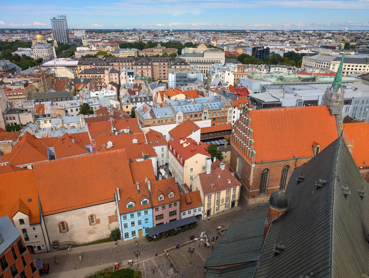 Rooftops of Riga Old Town seen from above, red tiles and church towers