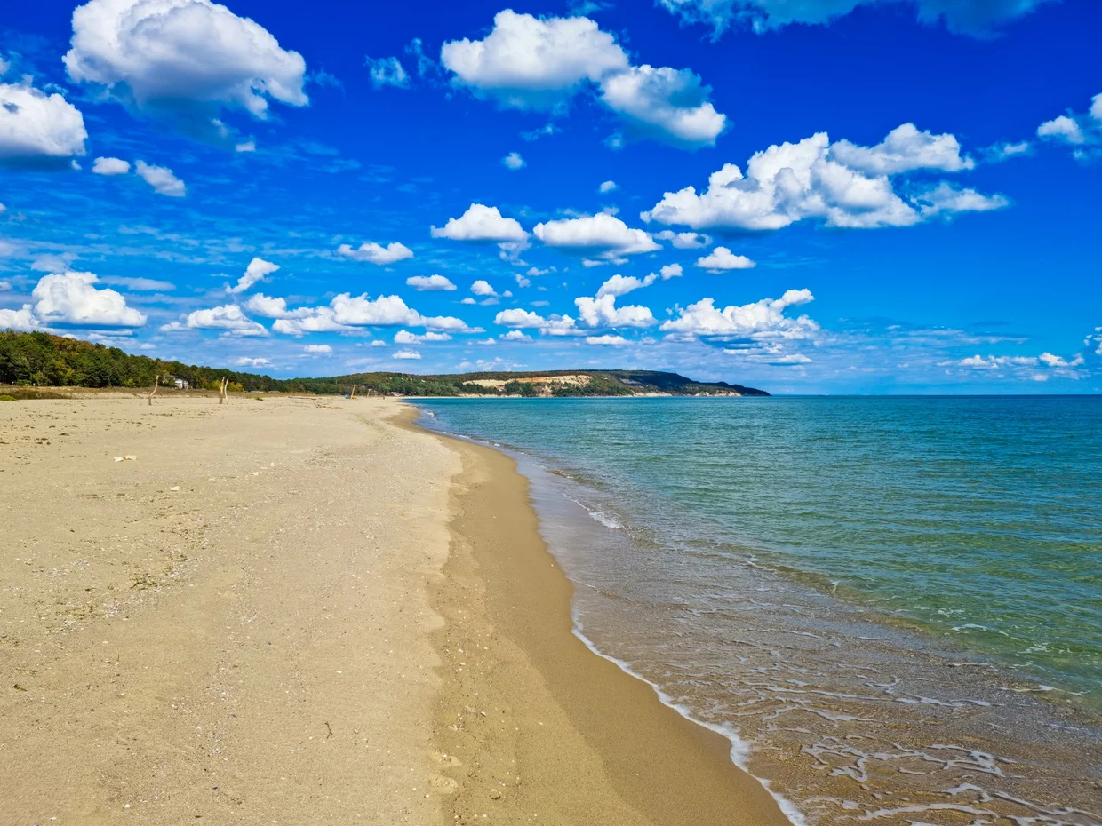 An empty Black Sea beach with golden sand and gentle waves