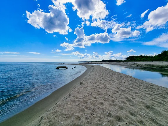 Beach sandbar between the sea and a natural lagoon