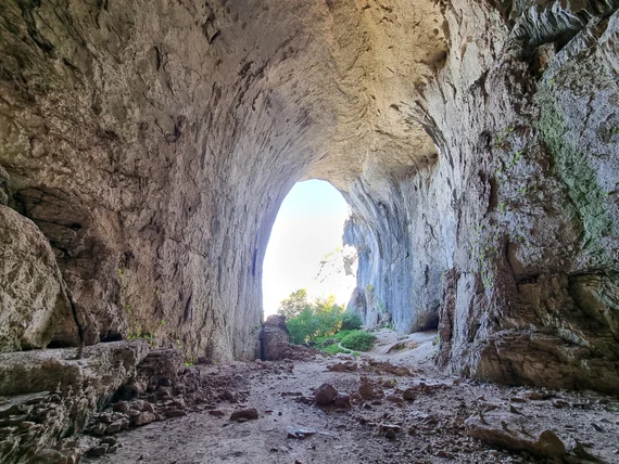 Inside Prohodna Cave, looking out through the arch