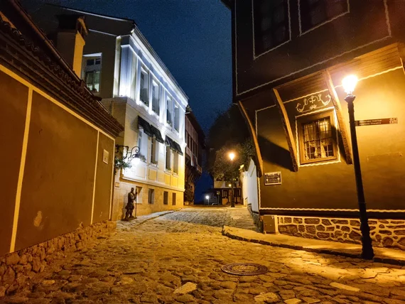 Revival-era houses illuminated at night