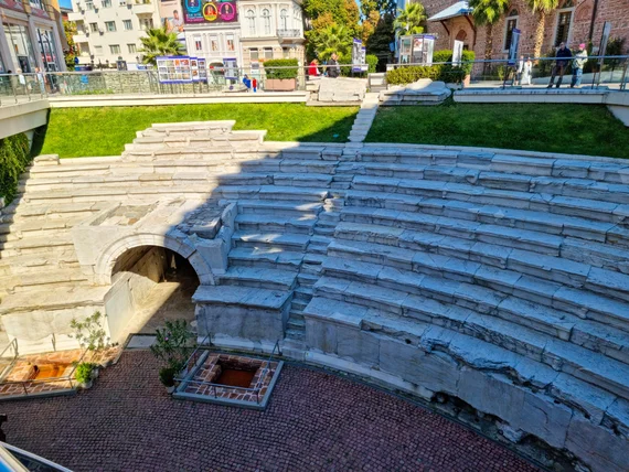 The Roman Stadium during the day, with the Dzhumaya Mosque behind it