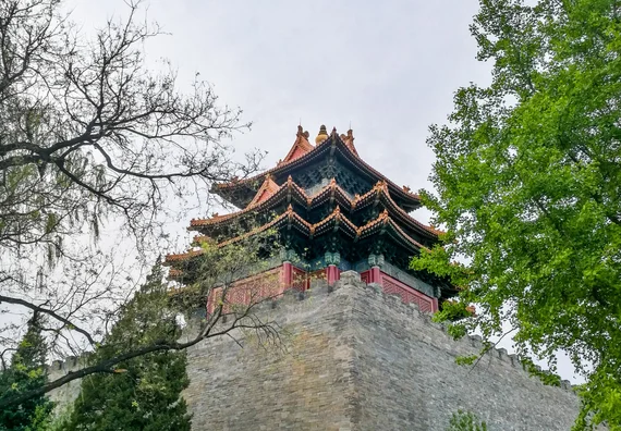 Corner watchtower of the Forbidden City reflected in the moat