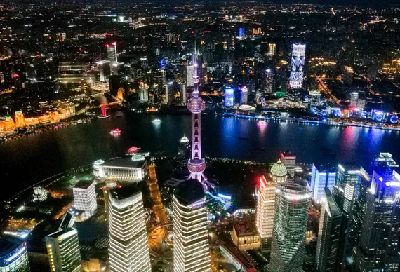Aerial night view of Shanghai Pudong with the Oriental Pearl Tower glowing