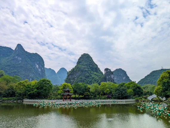 Pagoda pavilion on a lake with karst mountains in Guilin