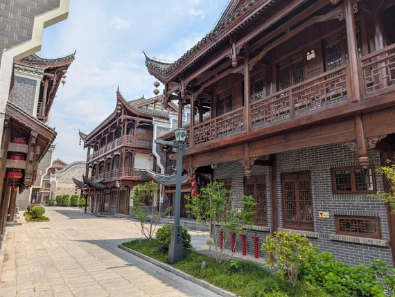 Traditional wooden Chinese architecture with carved lattice windows in a restored street