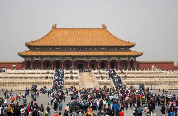Forbidden City Hall of Supreme Harmony with crowds of visitors in the courtyard