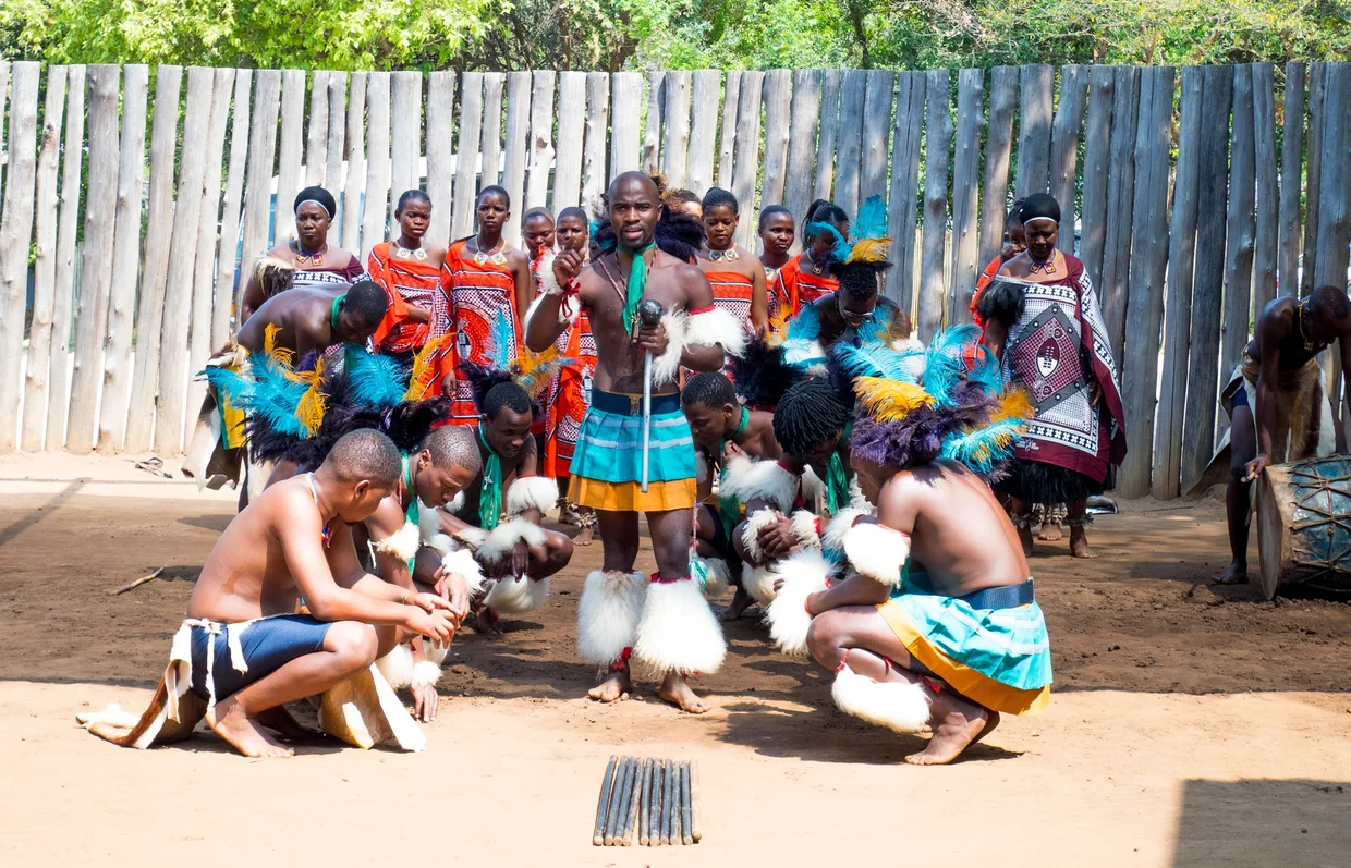 Swazi dancers in traditional attire performing at the Mantenga Cultural Village