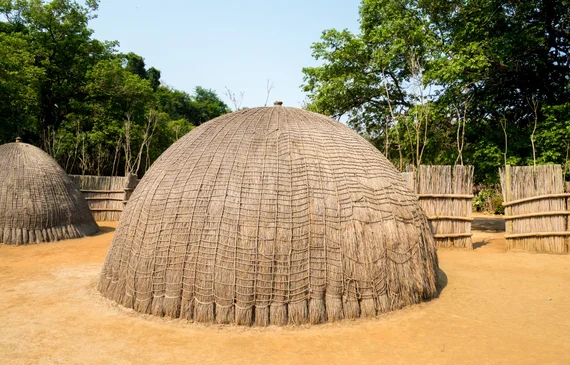Close-up of a traditional Swazi beehive hut with woven grass walls