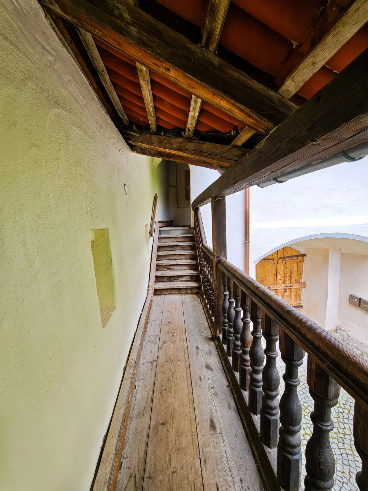 The covered wooden gallery inside St. Mang Abbey