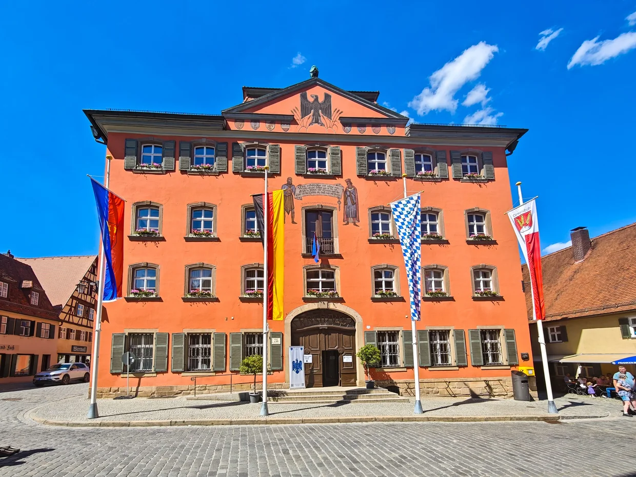 The orange Deutsches Haus with the double-eagle pediment