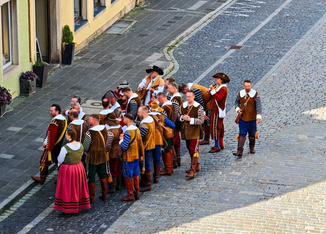 Men in 16th-century costume during the Pfingstfestspiele procession in Rothenburg
