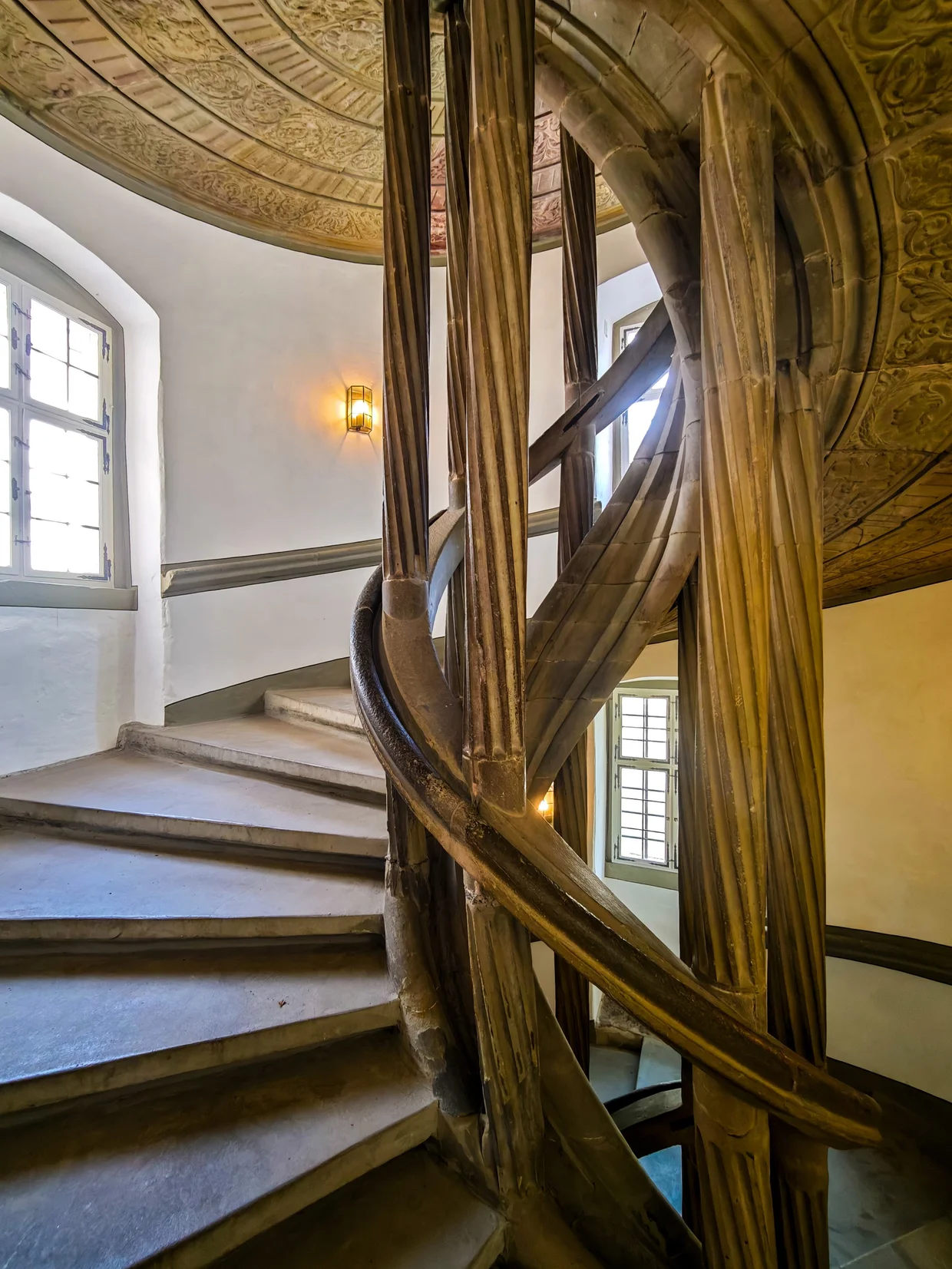 Spiral staircase with golden balustrade