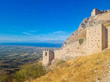 Walls of Acrocorinth fortress with view over coastal plain