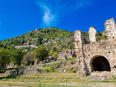 Ruined church walls and buildings leading up the Mystras slope