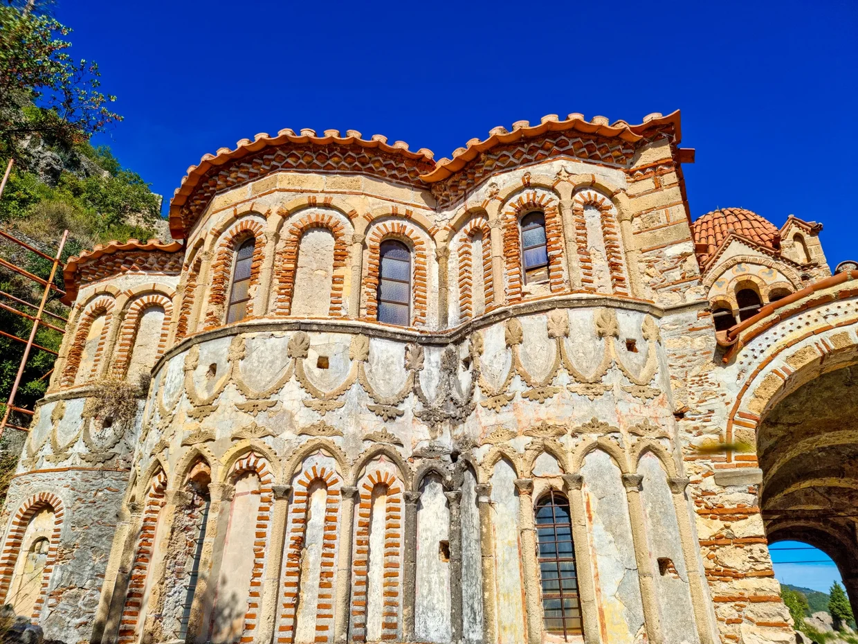 Detailed brick-patterned Byzantine church facade with small arched windows