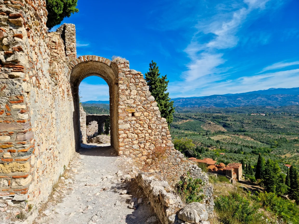Stone archway at Mystras with sweeping valley view