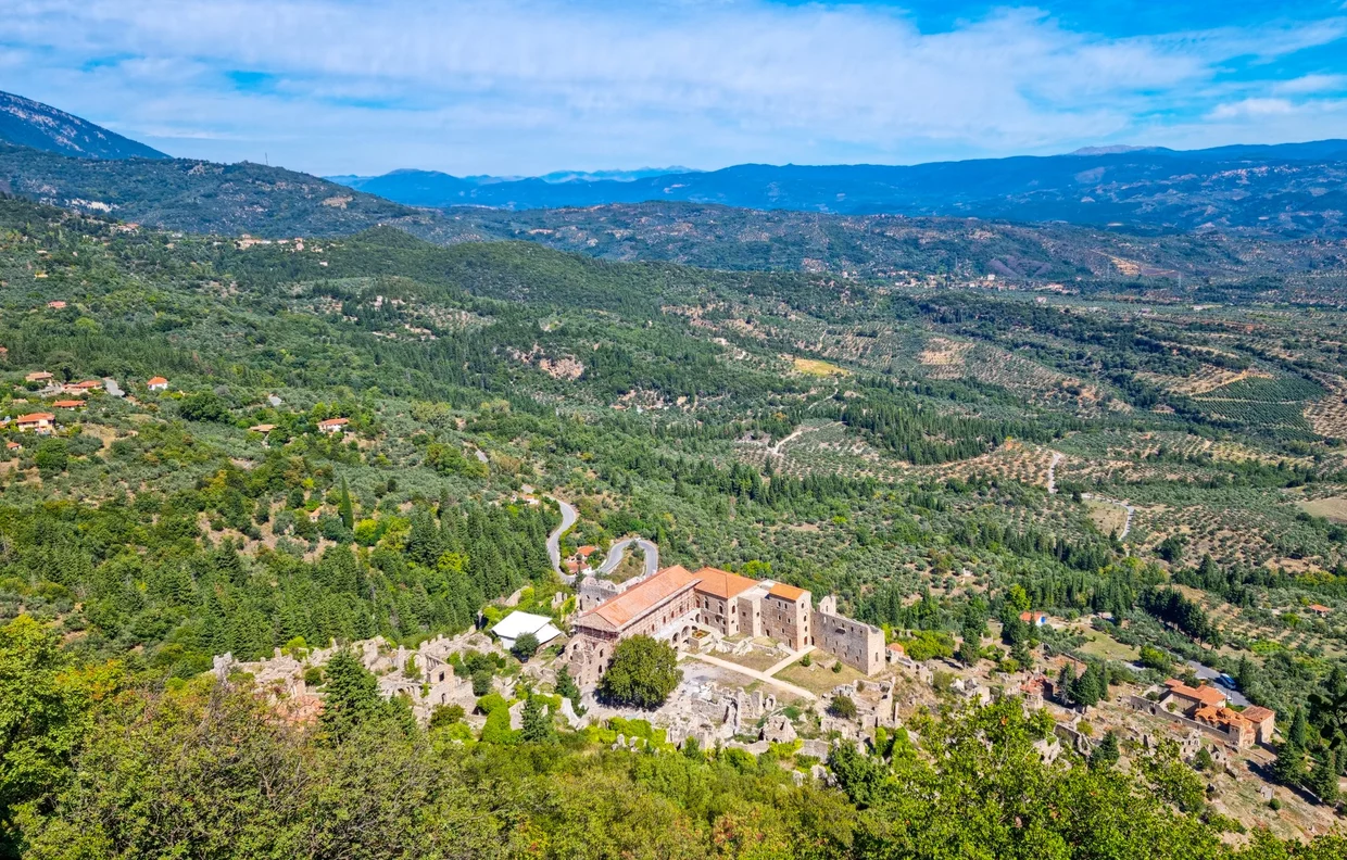 Aerial-like view of Mystras monastery complex in a forested valley