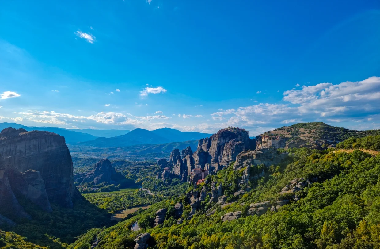Meteora valley seen from above with rock formations stretching to the horizon