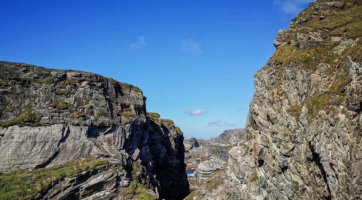 Rocky gorge with layered cliff walls at Mizen Head