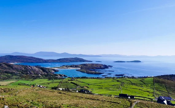 Turquoise bay and green patchwork fields on the Ring of Kerry