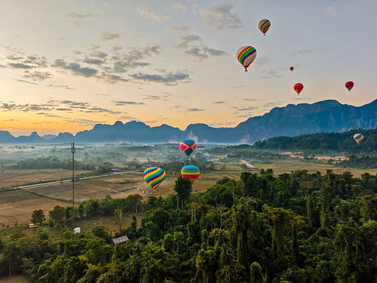 Hot air balloons over Vang Vieng at sunrise