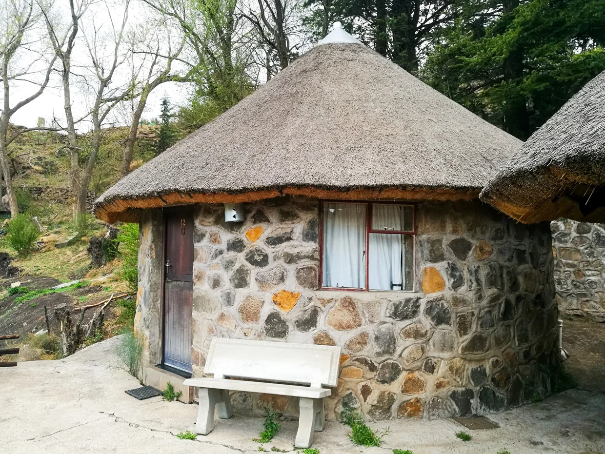 A traditional round stone hut at the lodge