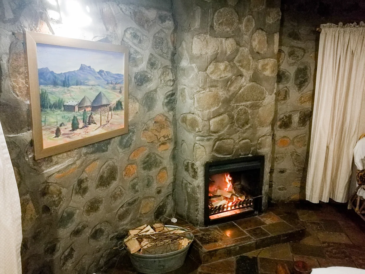 Fireplace inside a stone lodge room