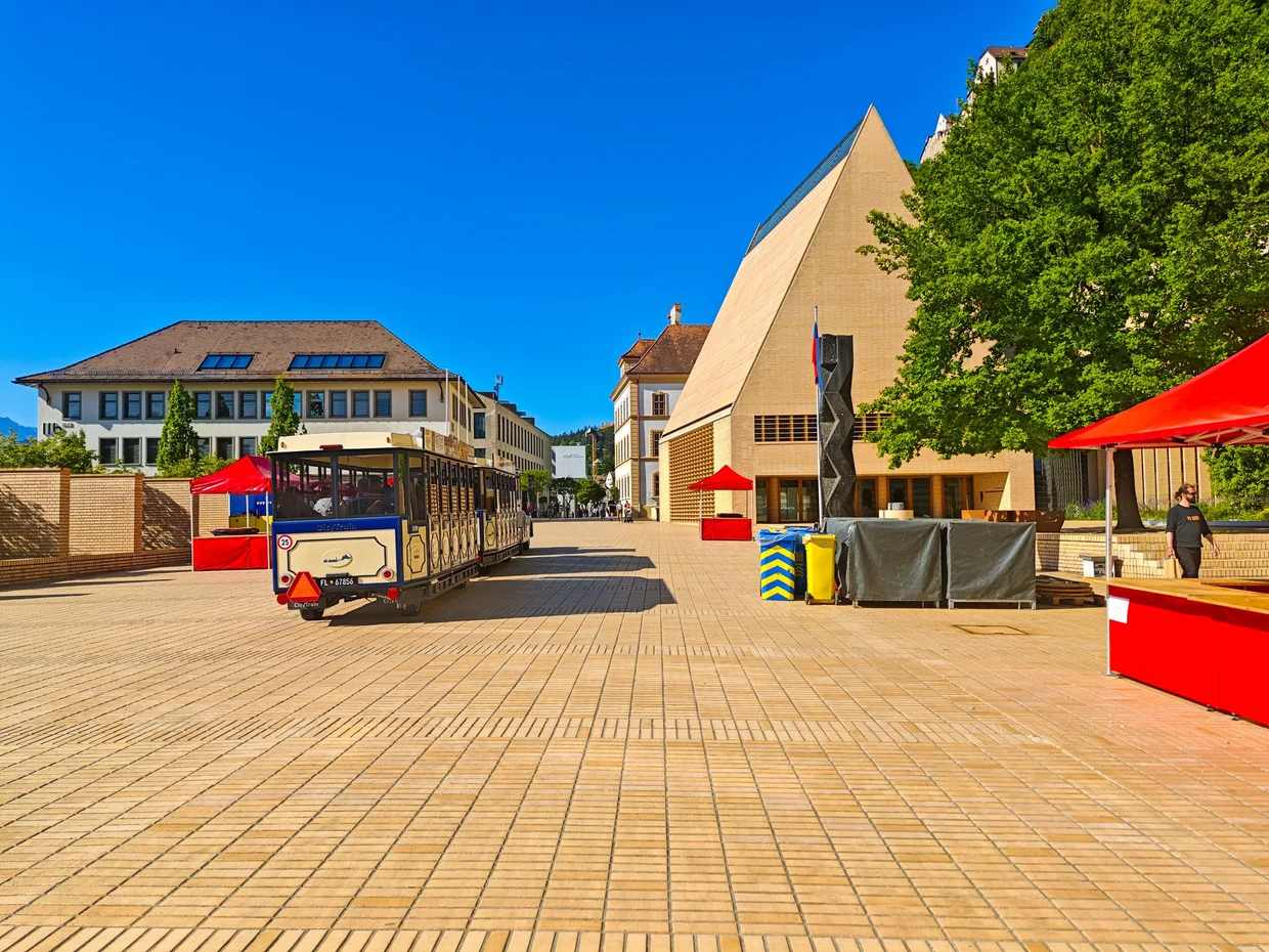 Empty pedestrian zone with the red tourist train and the Kunstmuseum behind
