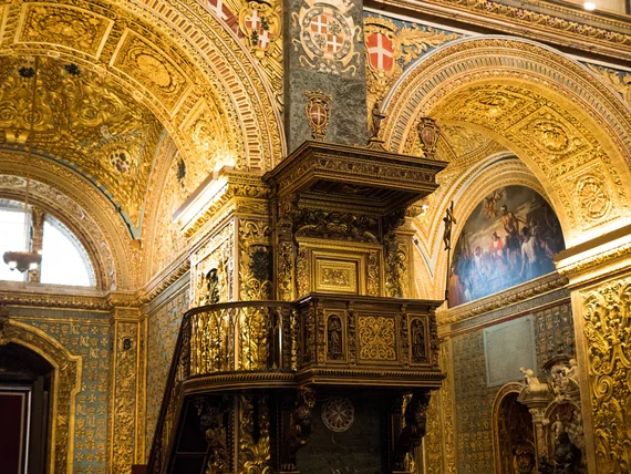 Painted roundel and Maltese cross heraldic shields