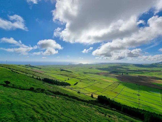 Green patchwork fields from Serra do Cume