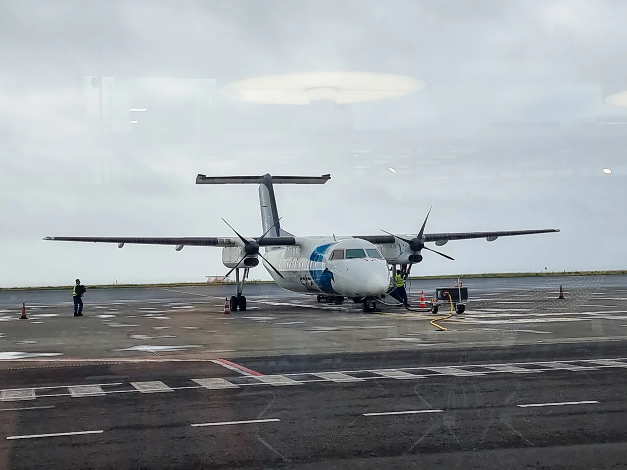 SATA inter-island turboprop on a rainy tarmac