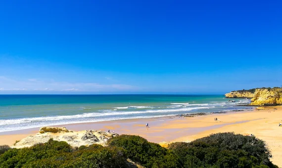 Algarve beach with turquoise water and golden sandstone cliffs