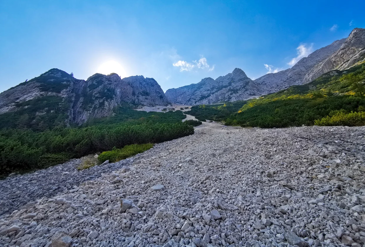 Alpine scree field below high mountains