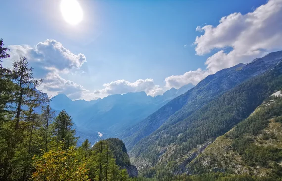 Hazy sunlit mountain valley panorama