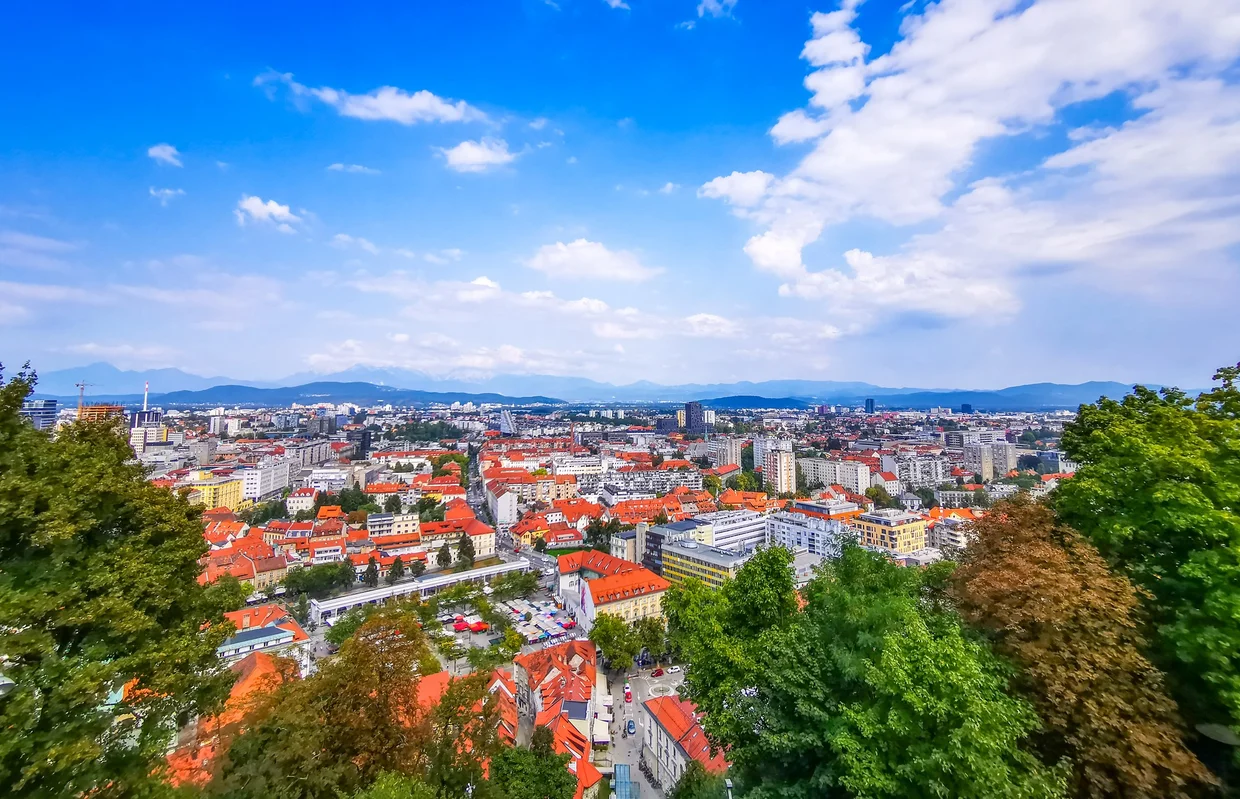 Ljubljana panorama with red roofs and distant hills