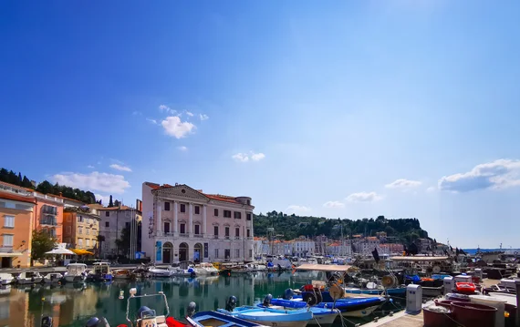 Piran harbour with boats and waterfront buildings