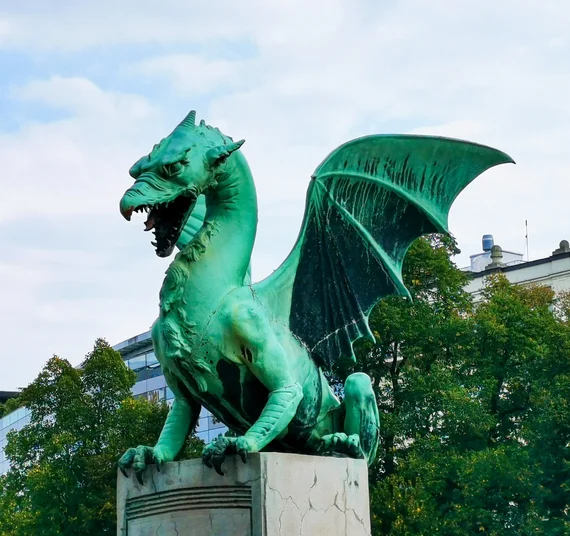 Green dragon statue close-up on the Dragon Bridge