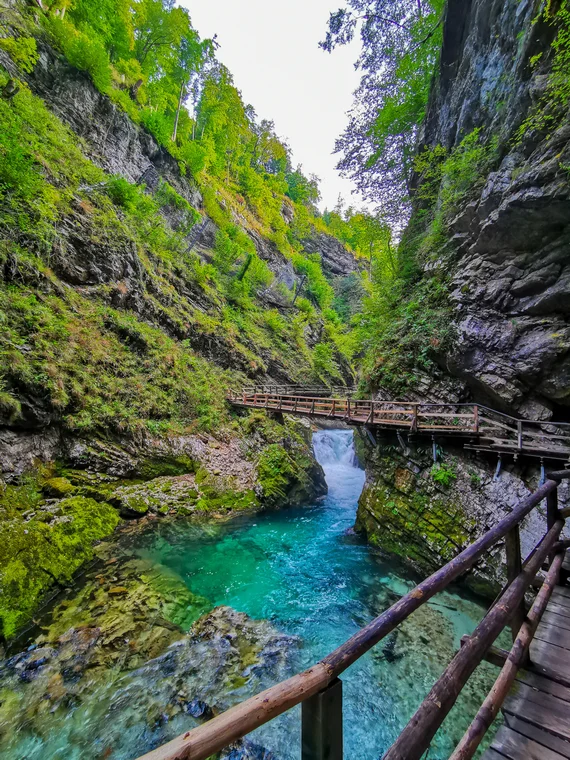 Gorge boardwalk crossing above vivid turquoise water