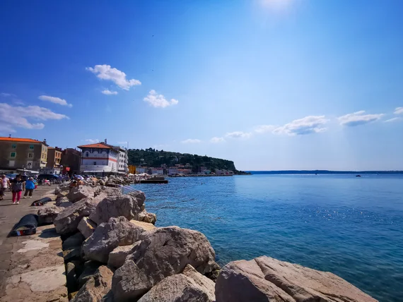 Rocky seaside promenade with calm water