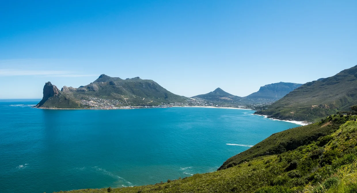Hout Bay seen from Chapman's Peak Drive, turquoise water and green mountains