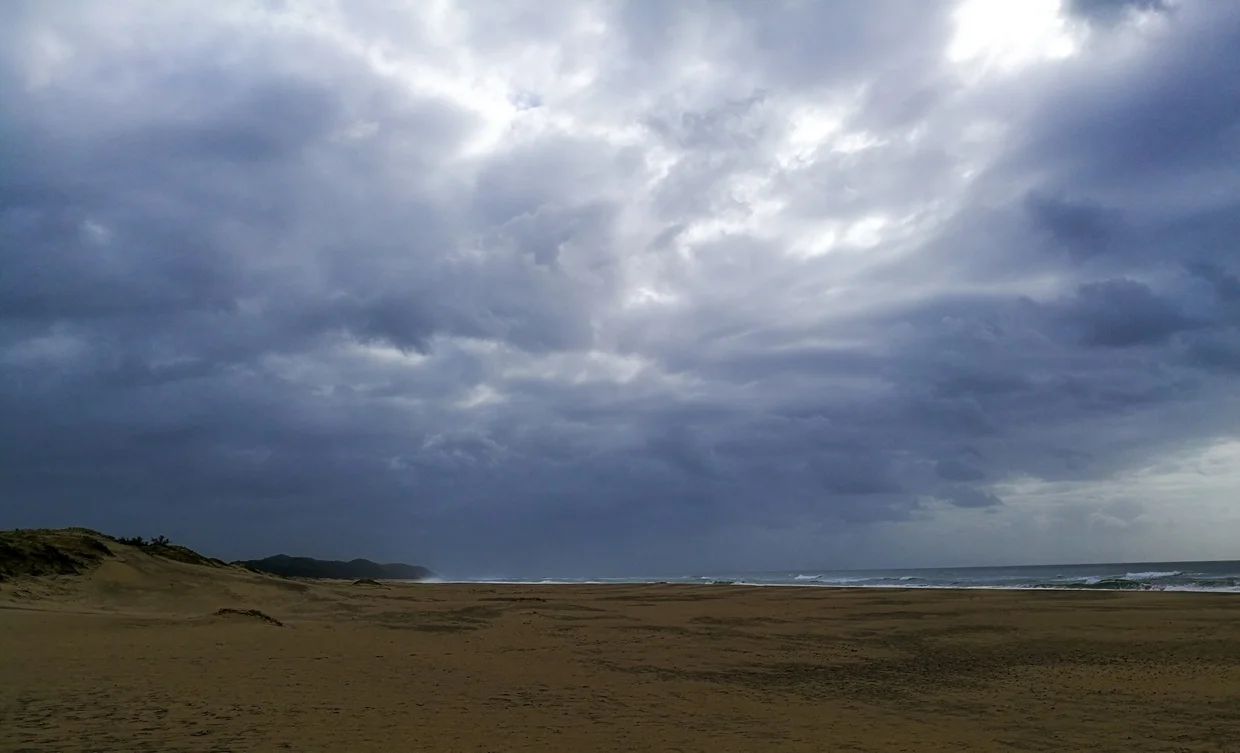 Stormy skies over the empty beach at iSimangaliso