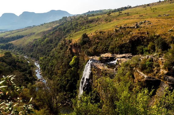 Lisbon Falls area with waterfall and mountain backdrop